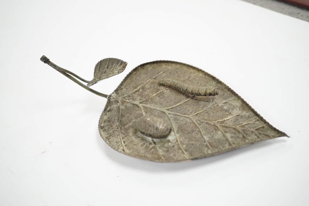 A Chinese white metal leaf dish, 16.4cm, two other Chinese items including a spirit lock and a Japanese white metal frame by Murai Shokai. Condition - poor to fair.